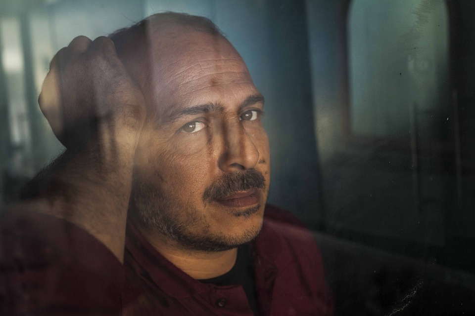 Blond girl showing her fist and muscles