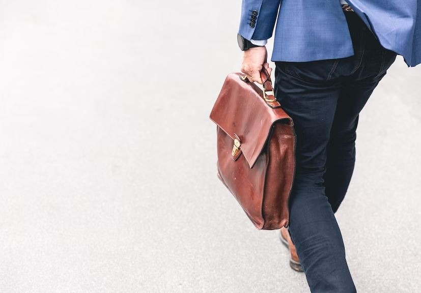 A worker walking outside