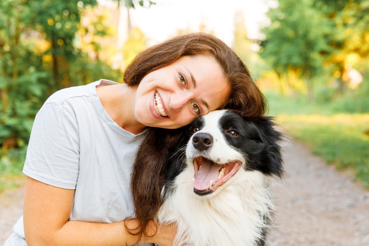 Female owner with her dog outside