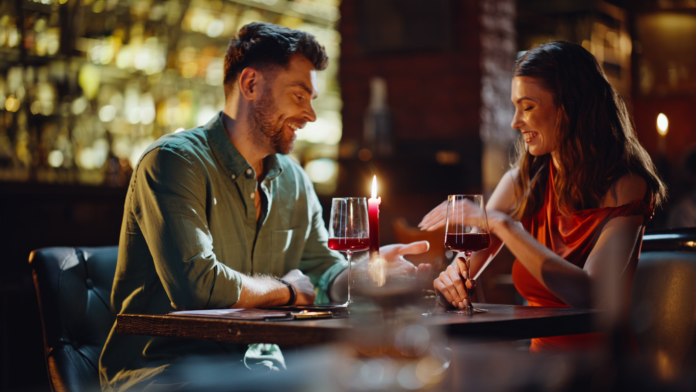a young couple having a dinner date at a restaurant