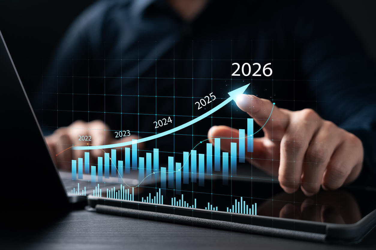 New Business Plan Setting Goals for the New Year 2026, businessman using laptop and tablet to strategize and develop the organization to grow to success in 2026, finding business opportunities