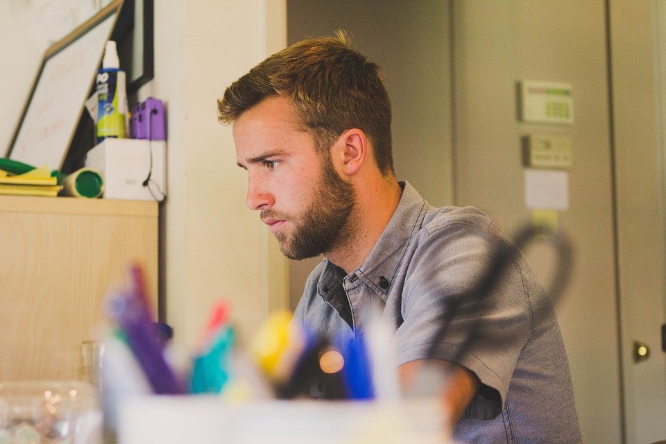 man focused and concentrating on work in the office