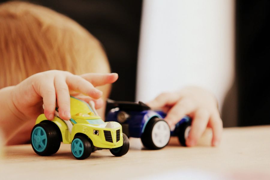 Kid playing toy car