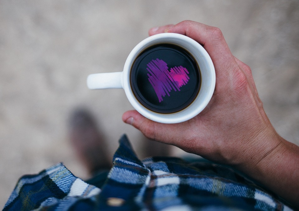 A cup of coffee with heart on it