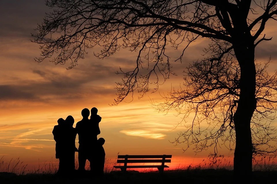 A family watching sunset