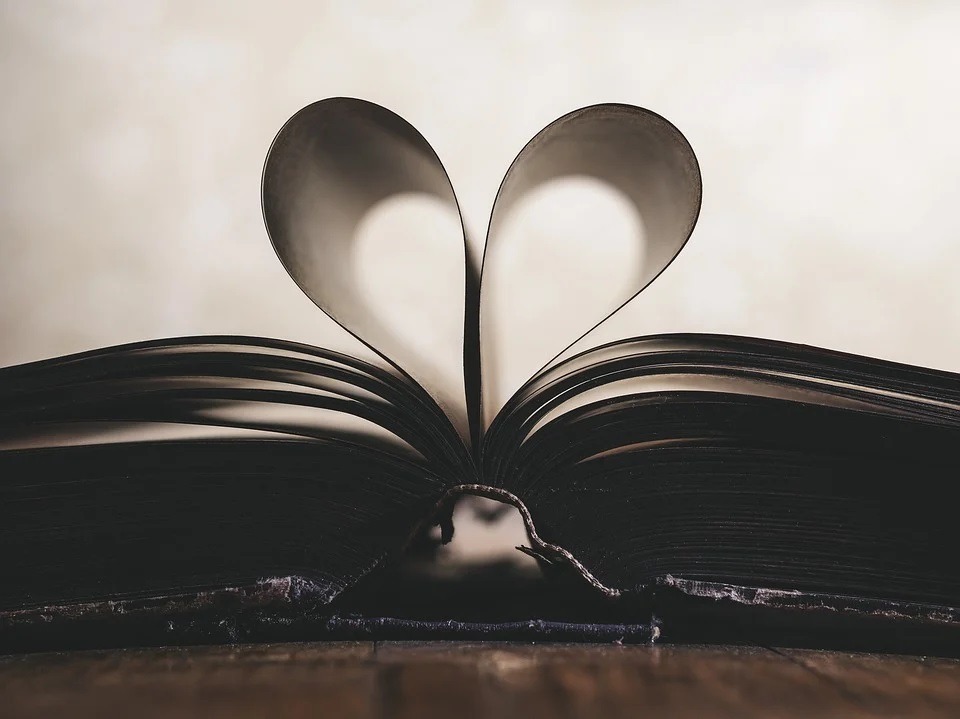 Book pages turned to form a heart