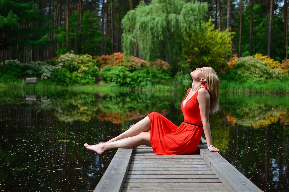 woman relaxing by the lake